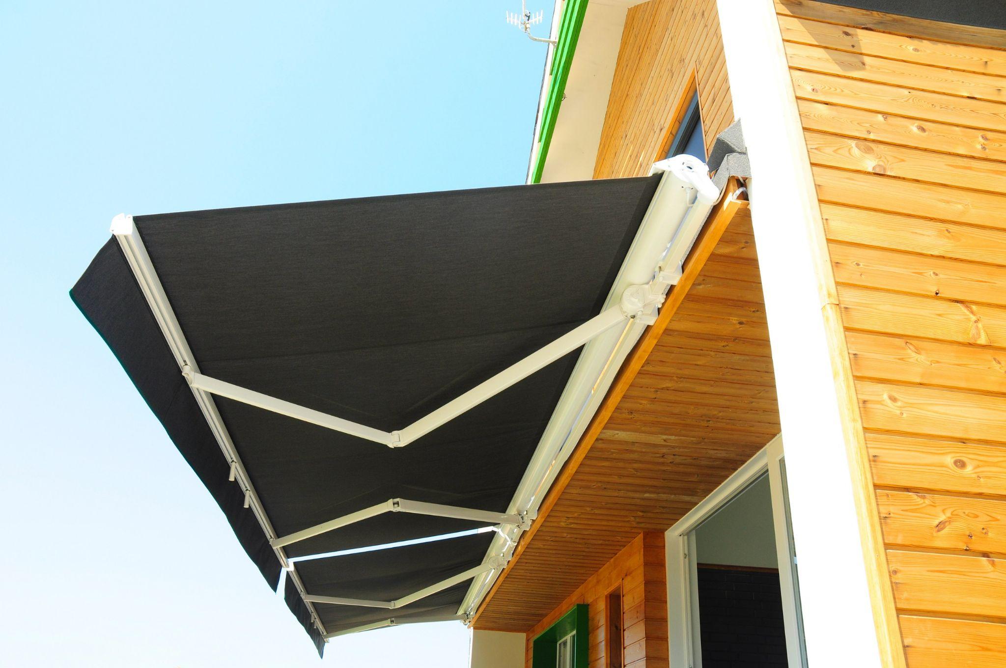 Retractable awning extended over a patio area, providing shade and outdoor comfort